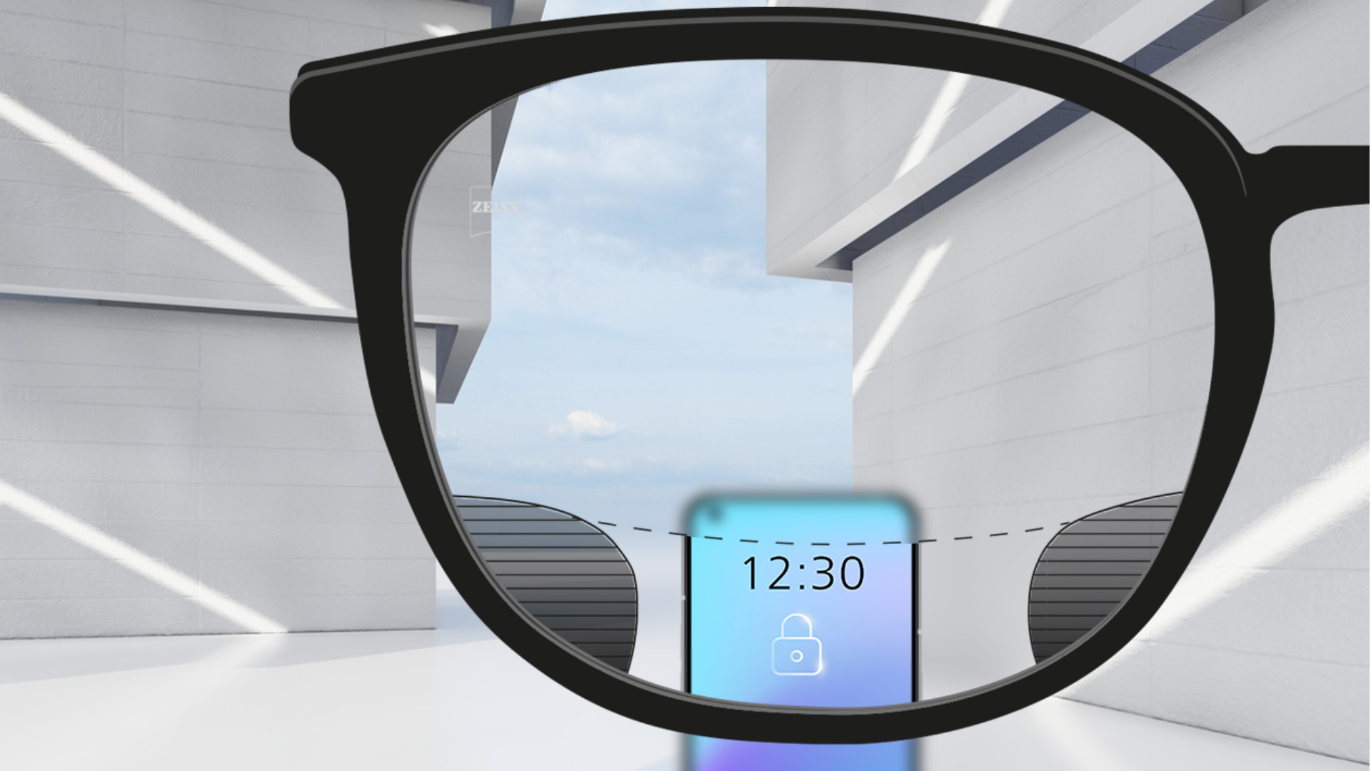 Een point-of-view-beeld met ZEISS Digital SmartLife brillenglazen met een smartphone, waarbij het bovenste en onderste gedeelte van het objectief volledig helder is en met links en rechts kleine onscherpe delen.