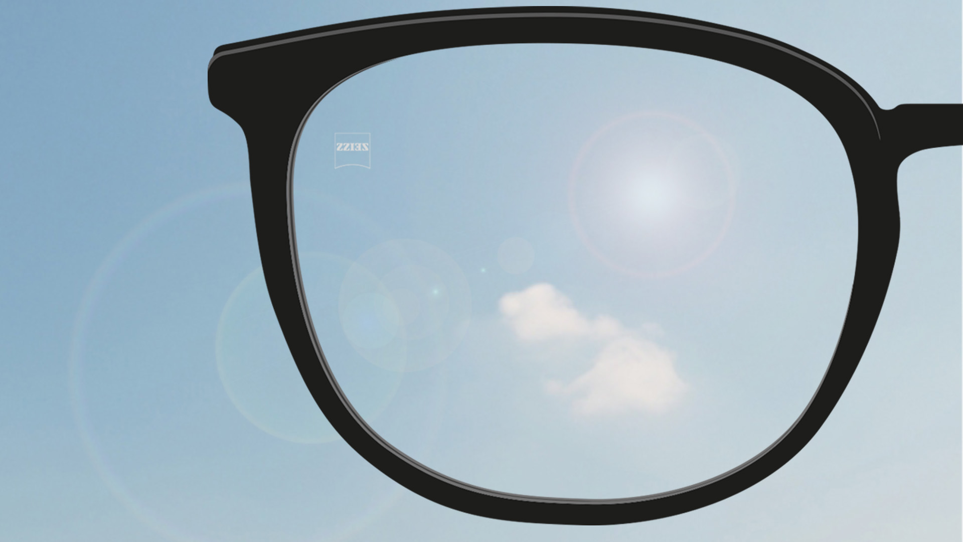 Een point-of-view-foto met de zon die op het brillenglas schijnt.